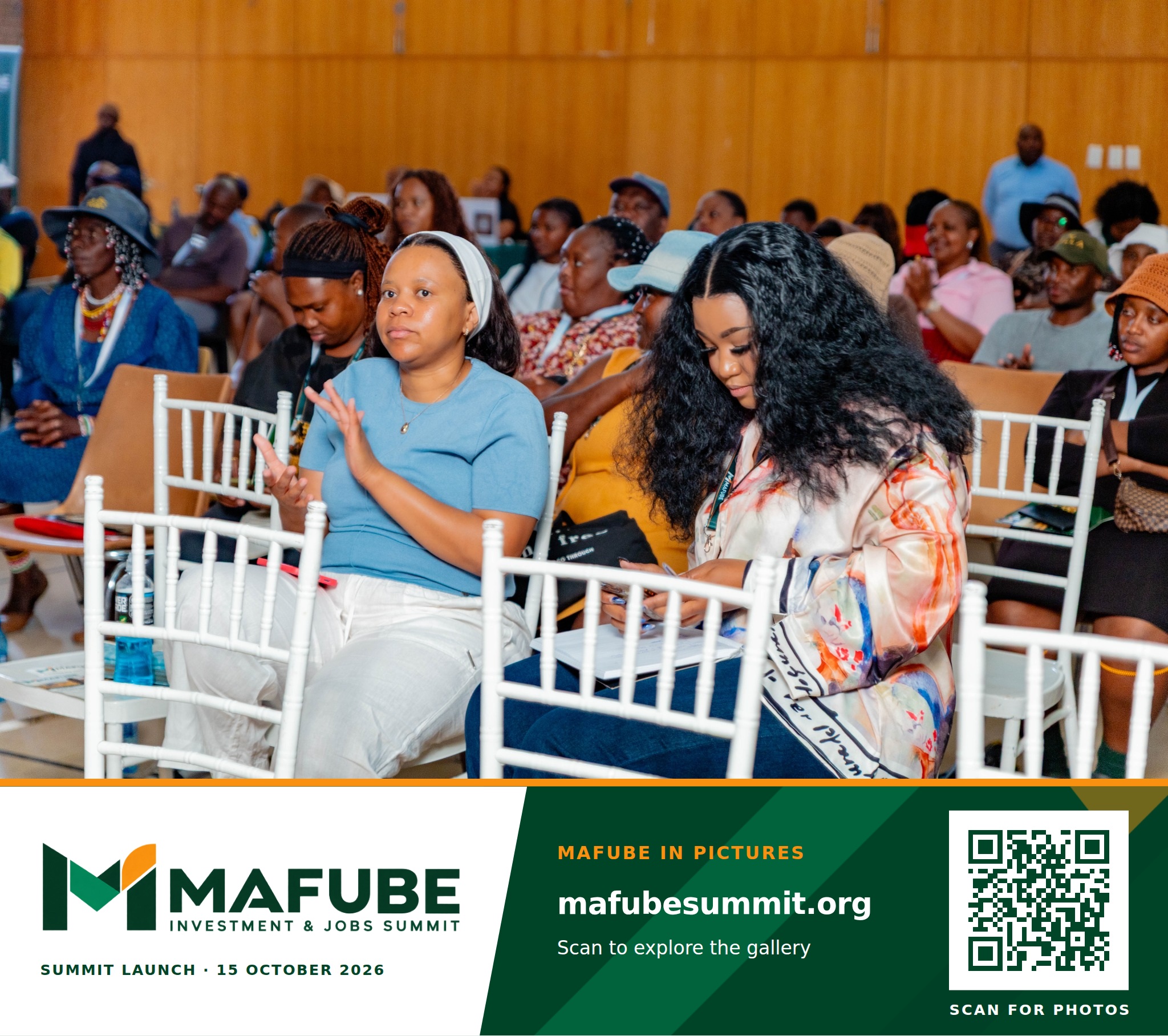 Participants seated in the hall applaud, with the Mafube Investment & Jobs Summit photo footer